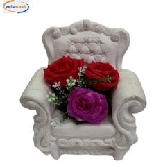 COMPOSIZIONE POLTRONA IN PIETRA CON FIORI