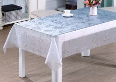 TOVAGLIA CERATA CON FIORI TRASPARENTE CM 140